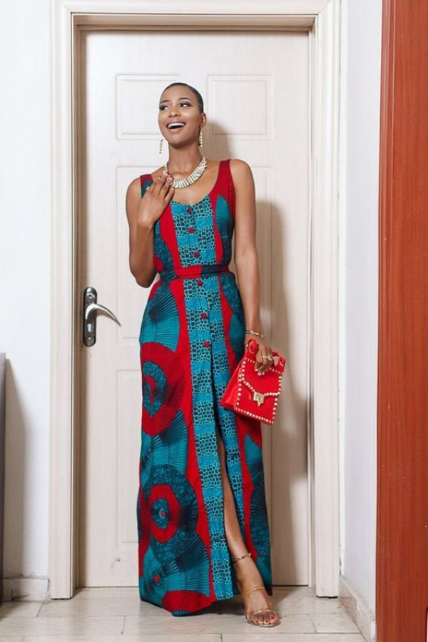 Step out in style with a turquoise vitenge outfit, paired with a fiery red clutch