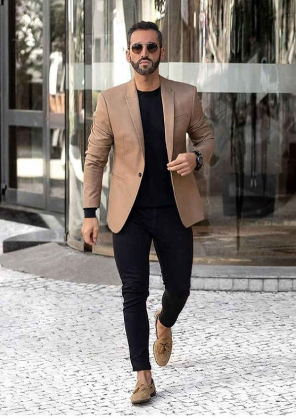 Spice up your attire with a woolen brown blazer and some sleek black trousers