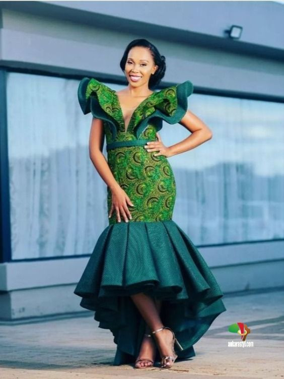 She's stunning in a green fishtail dress with perfect peplum on her big day.