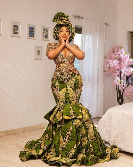 You'd totally look awesome on your Wedding Day in that figure-hugging dress with the flared bottom and lush green patterns!