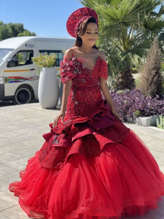 Twirl around in this stunning red ball gown, girl! Off-shoulder vibes, and cascading ruffles!