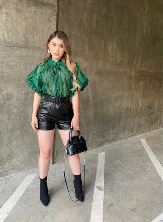 This bold green top and black leather shorts would look amazing on you!