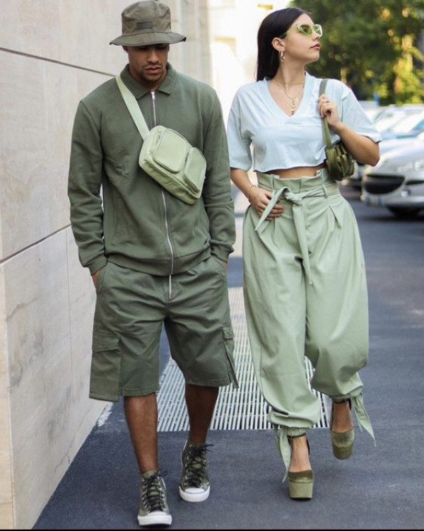 Their couple matching outfit features a gentle touch of green fabric, creating a match in mossy hues