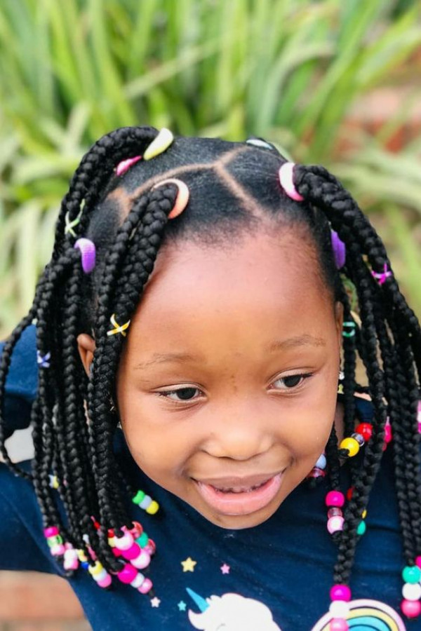 Create some vibrant fun with dark box braids for kids, jazzed up with a rainbow of beads