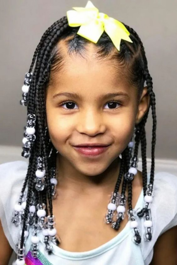 Give your child's hair a touch of moonlight with box braids embellished in silver beads