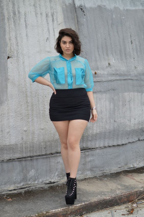 Bold blend alert! This curvy white girl's got the perfect mix of blue sheer and a mini skirt