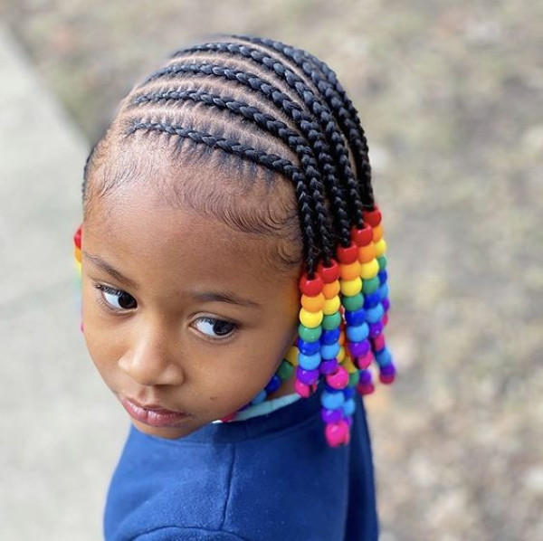 Get ready for a burst of color with kids' box braids that pop with a rainbow of beads