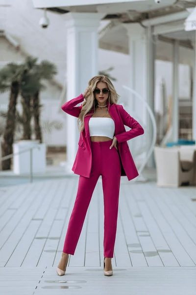 Pink outfit inspo with blazer, trousers, sportswear, formal business attire