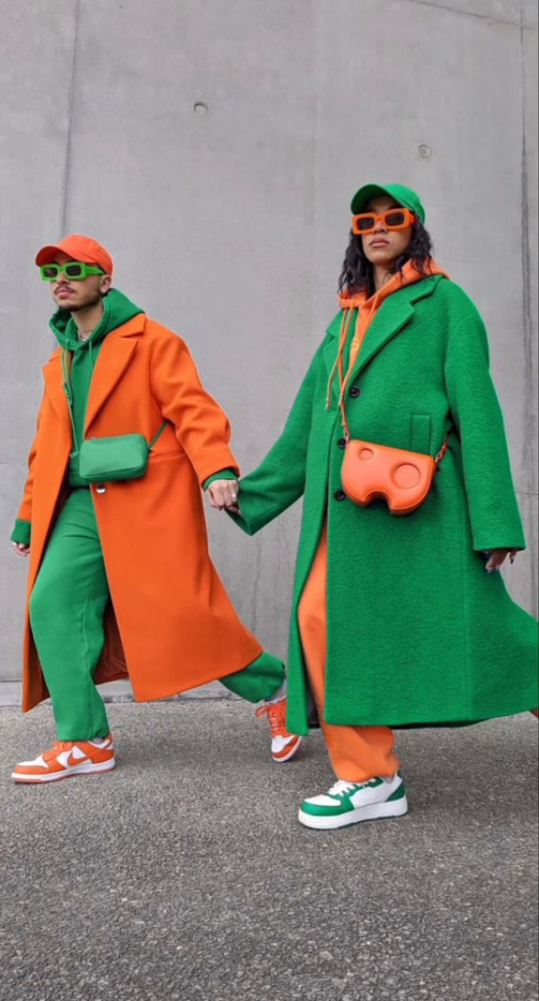 With bold green and orange overcoats, they've gone for a couple's matching outfit that pops with color